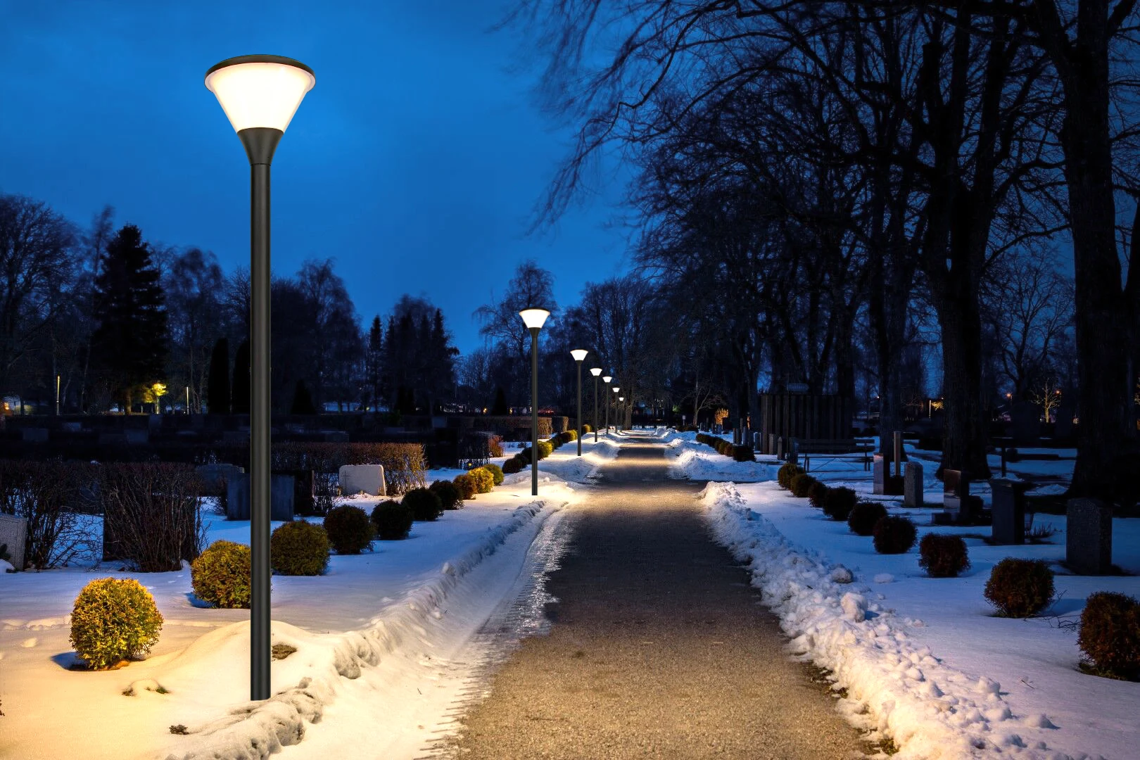 SGL-006 illuminating snow-lined park pathway in winter