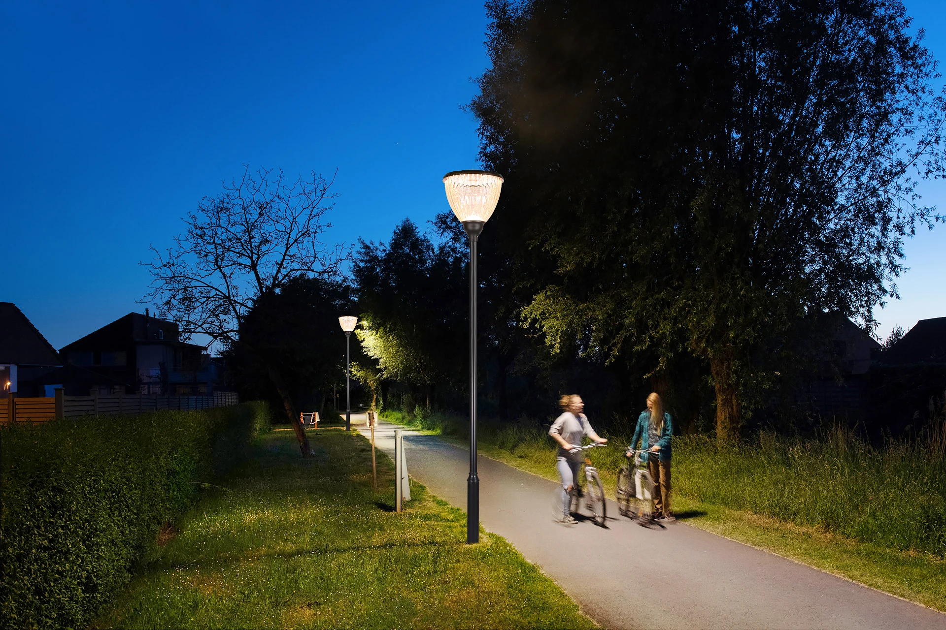 Riverside greenway bicycle path dusk illumination