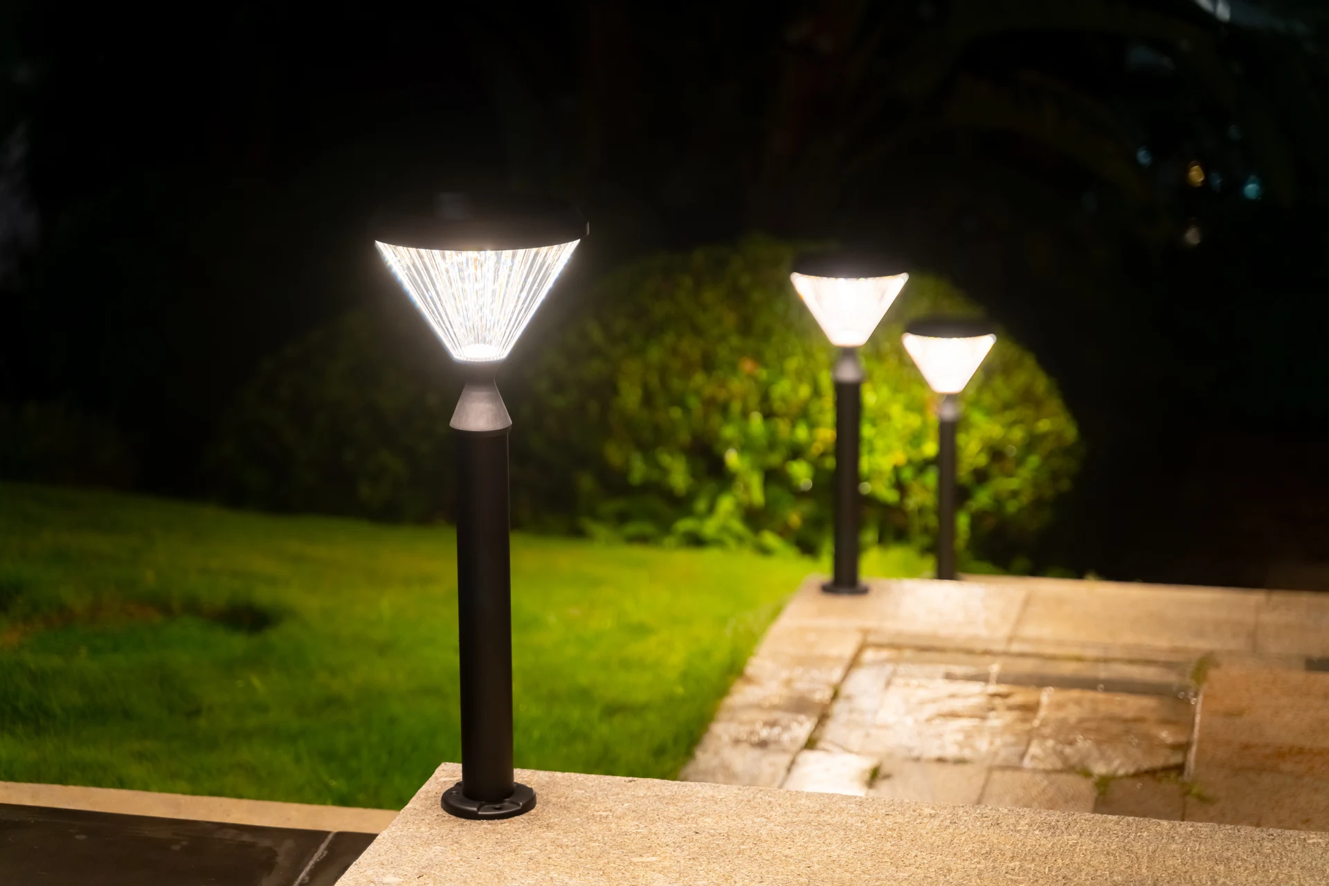 SGL-4505 solar garden lights along garden stone terrace pathway at night