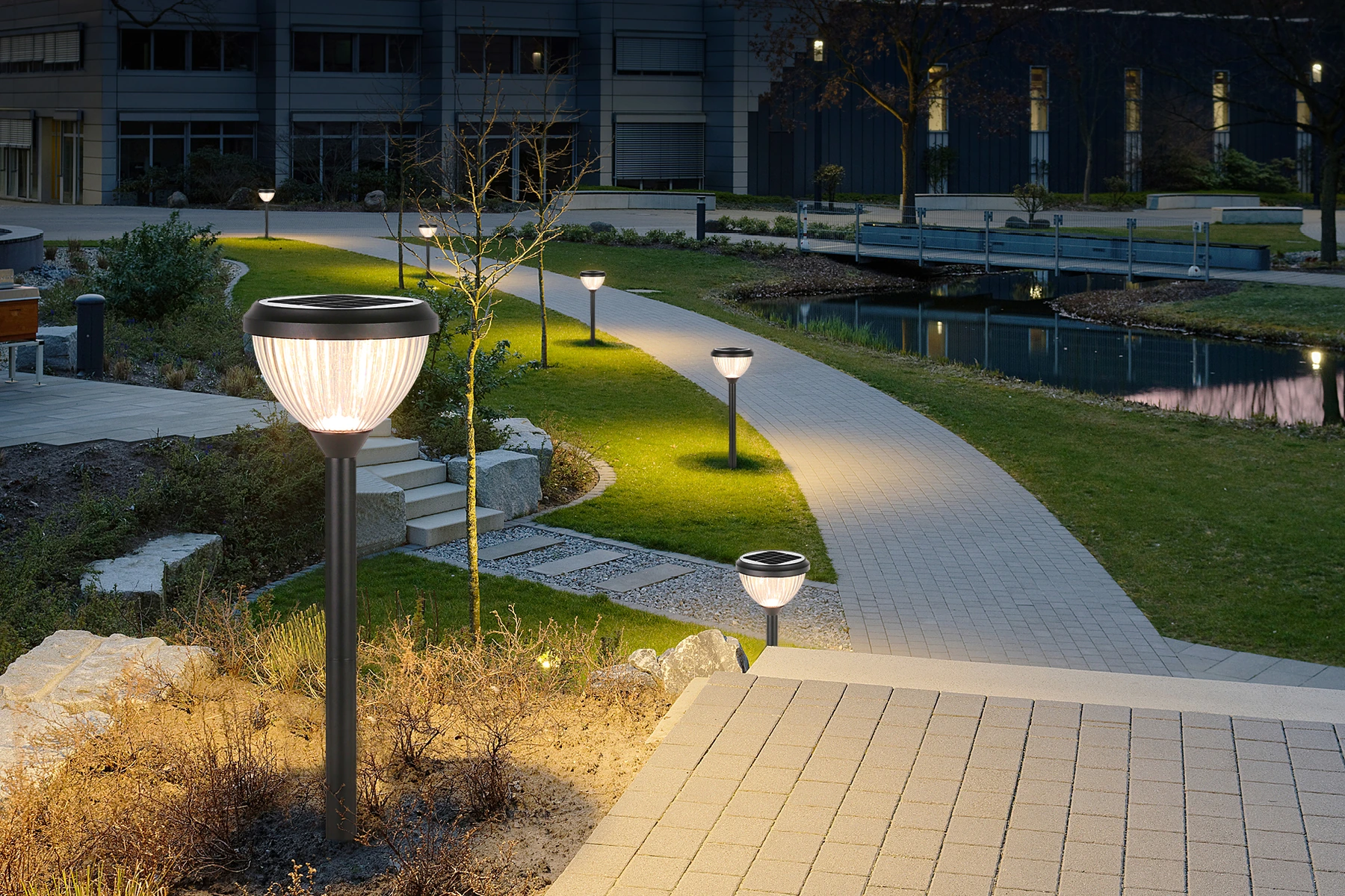 SLL-0705 pumpkin solar bollards along manicured garden pathway