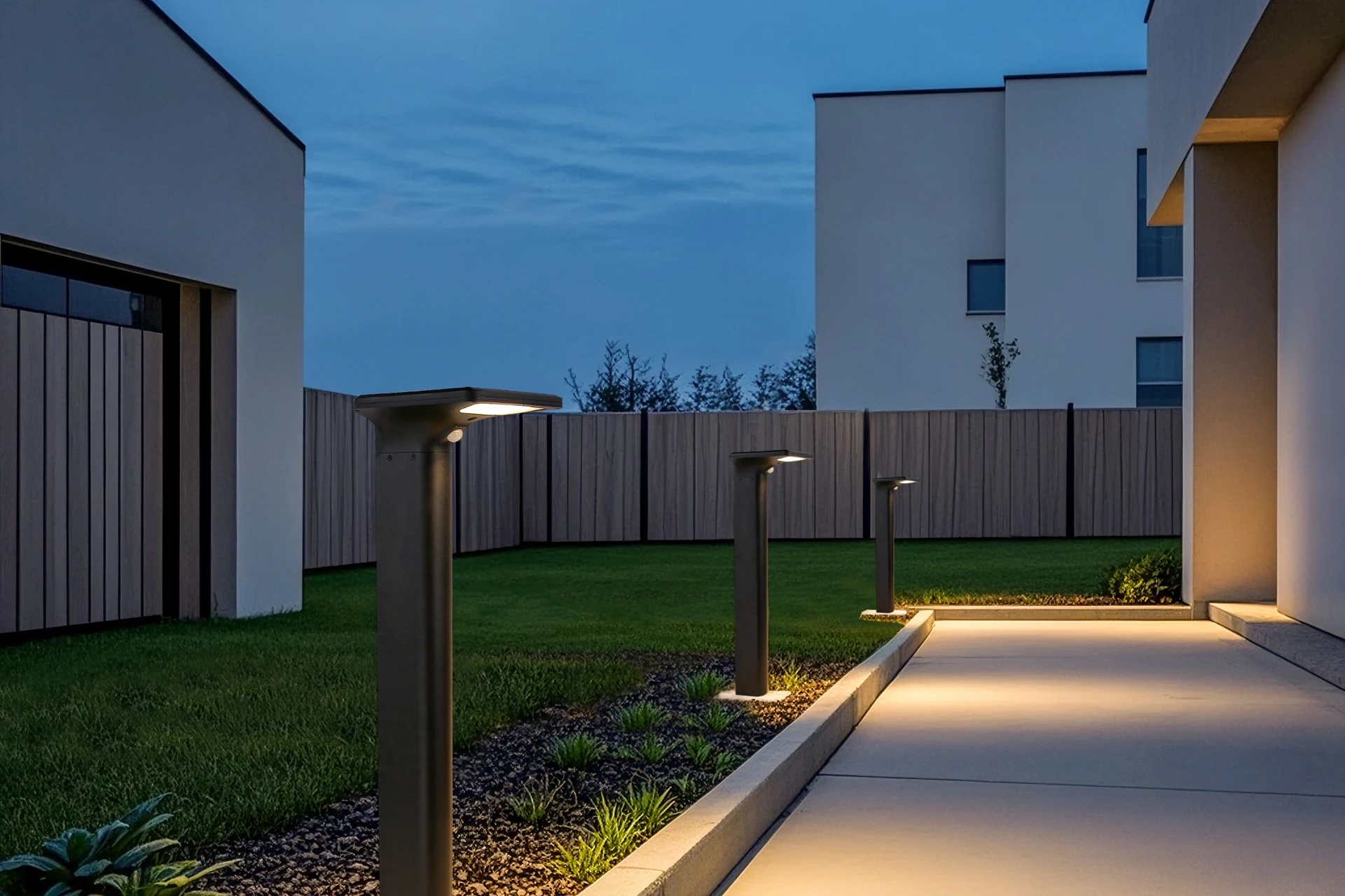 SLL-3005 crescent bollards defining lush lawn courtyard borders