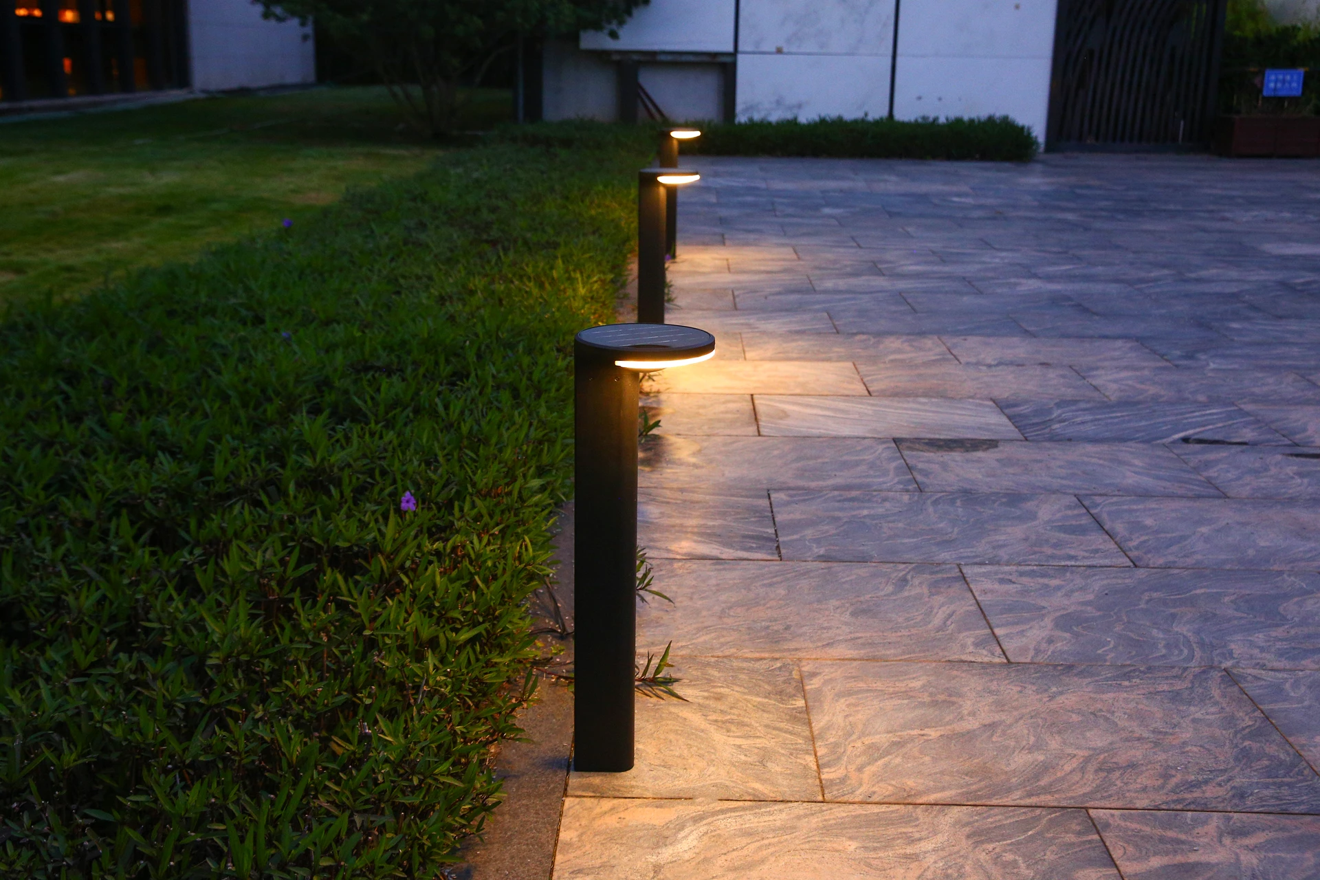 SLL-8804 solar bollard lights along garden stone terrace pathway