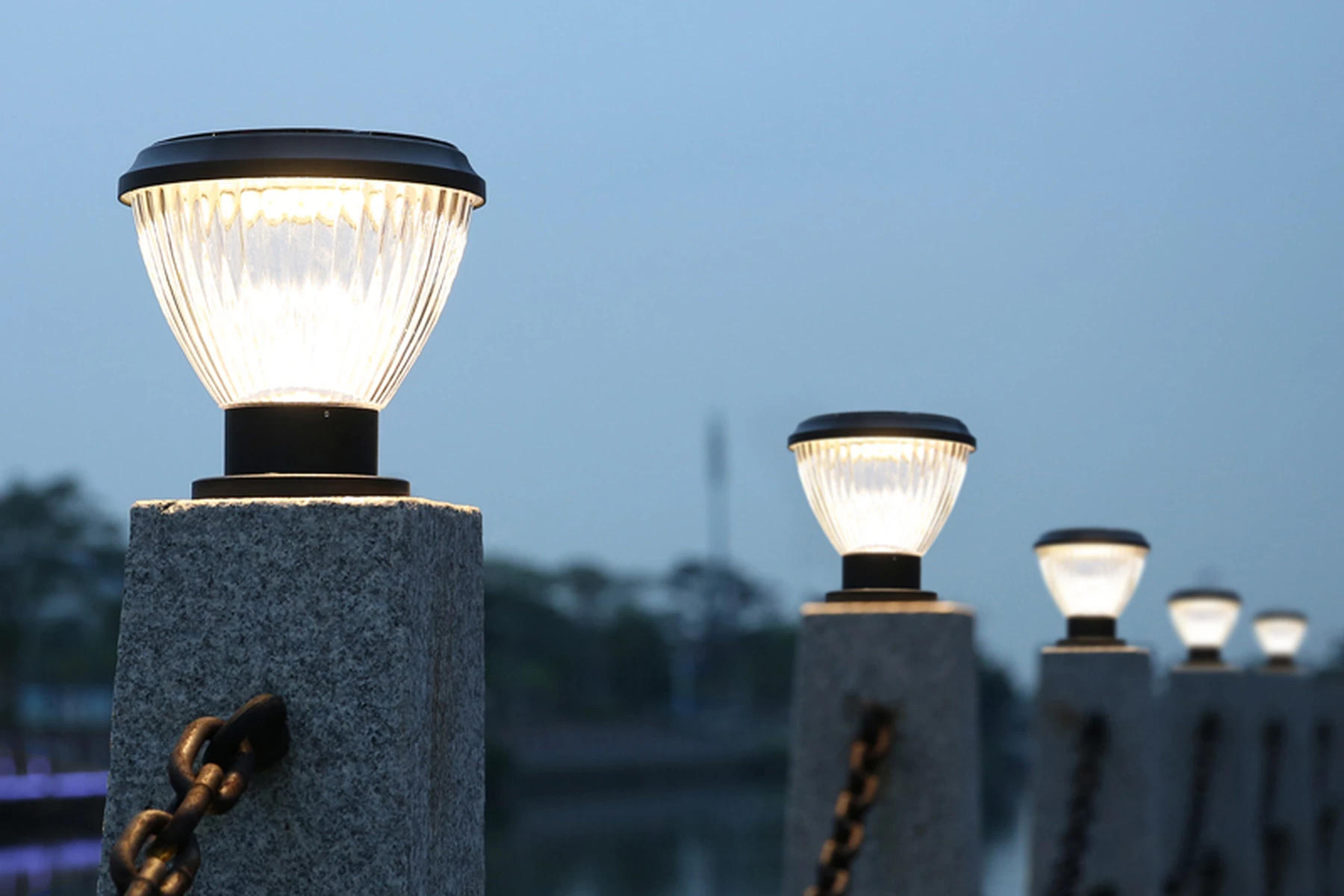 SPL-4104 pumpkin solar pillar lights along waterside stone pier promenade