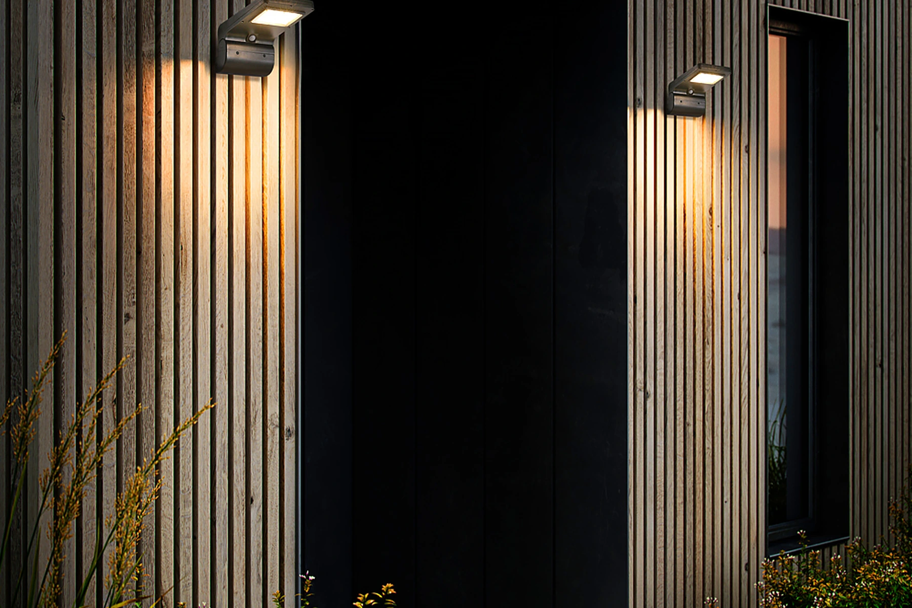 SWL-1006 solar wall lights flanking contemporary timber slat entrance facade
