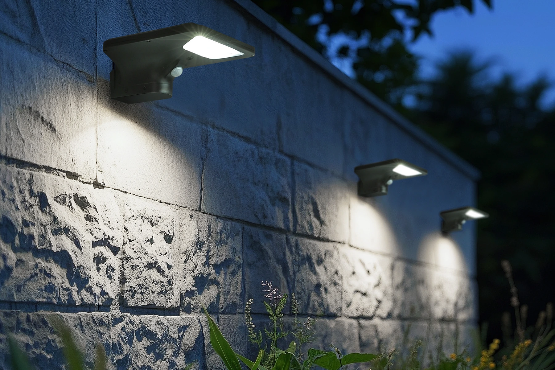 SWL-3005 solar wall sconces mounted on rustic stone wall with garden flowerbed