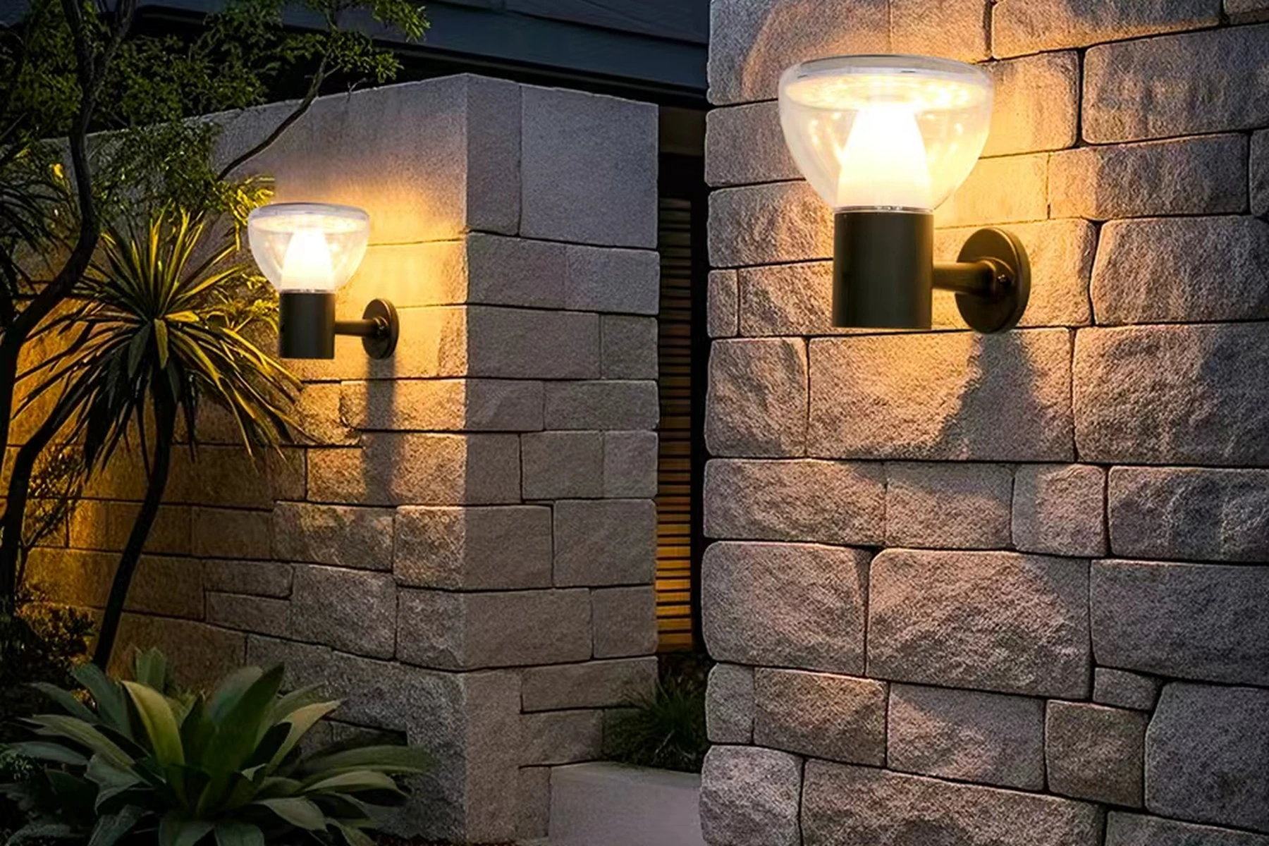 SWL-3006 firmament solar wall lights installed along rustic stone boundary pillars at sunset