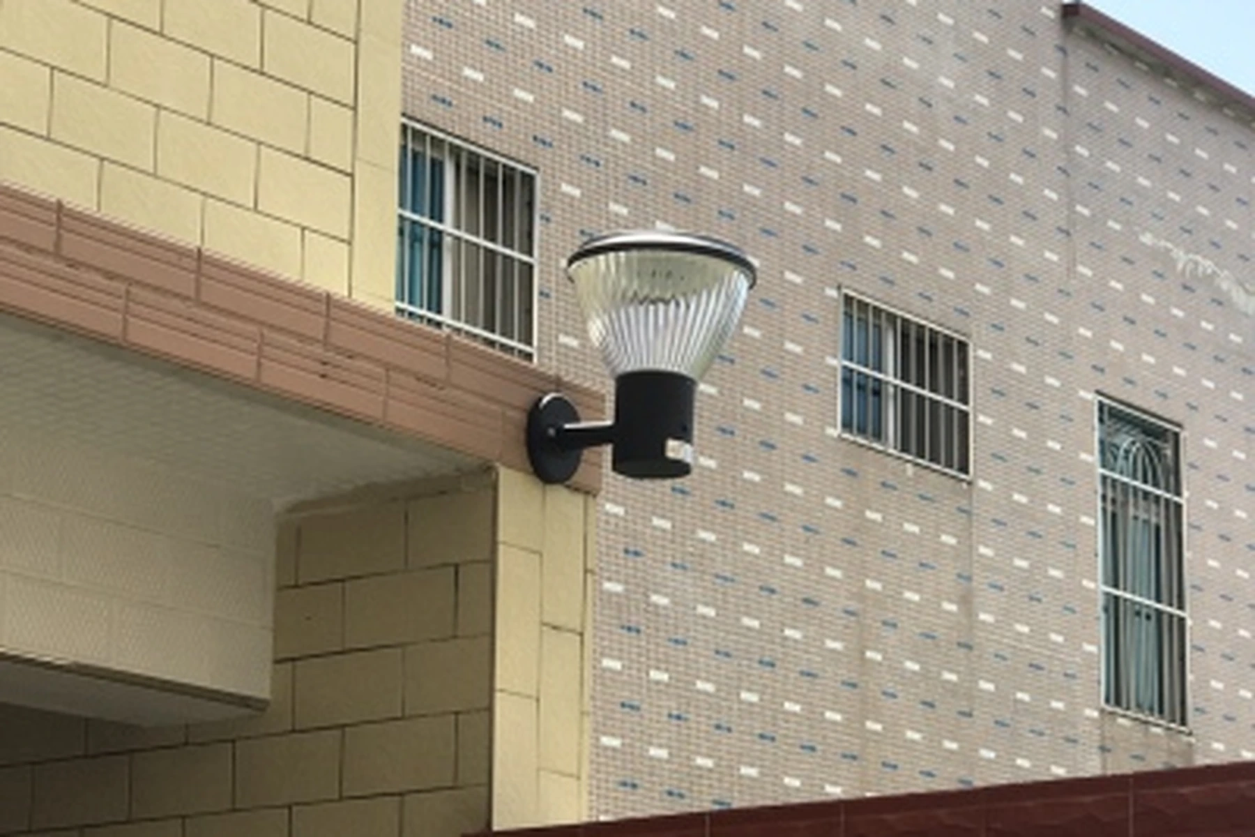 SWL-4001 pumpkin wall sconce installed on exterior residential building facade