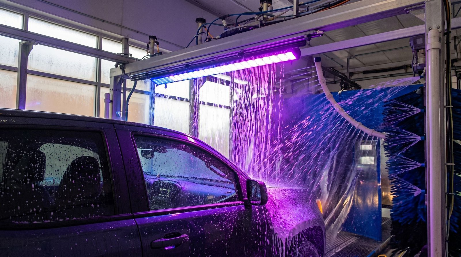 Impression 1 LWW-OP-D80 wall washer lighting a car wash tunnel in purple | TPK Lighting