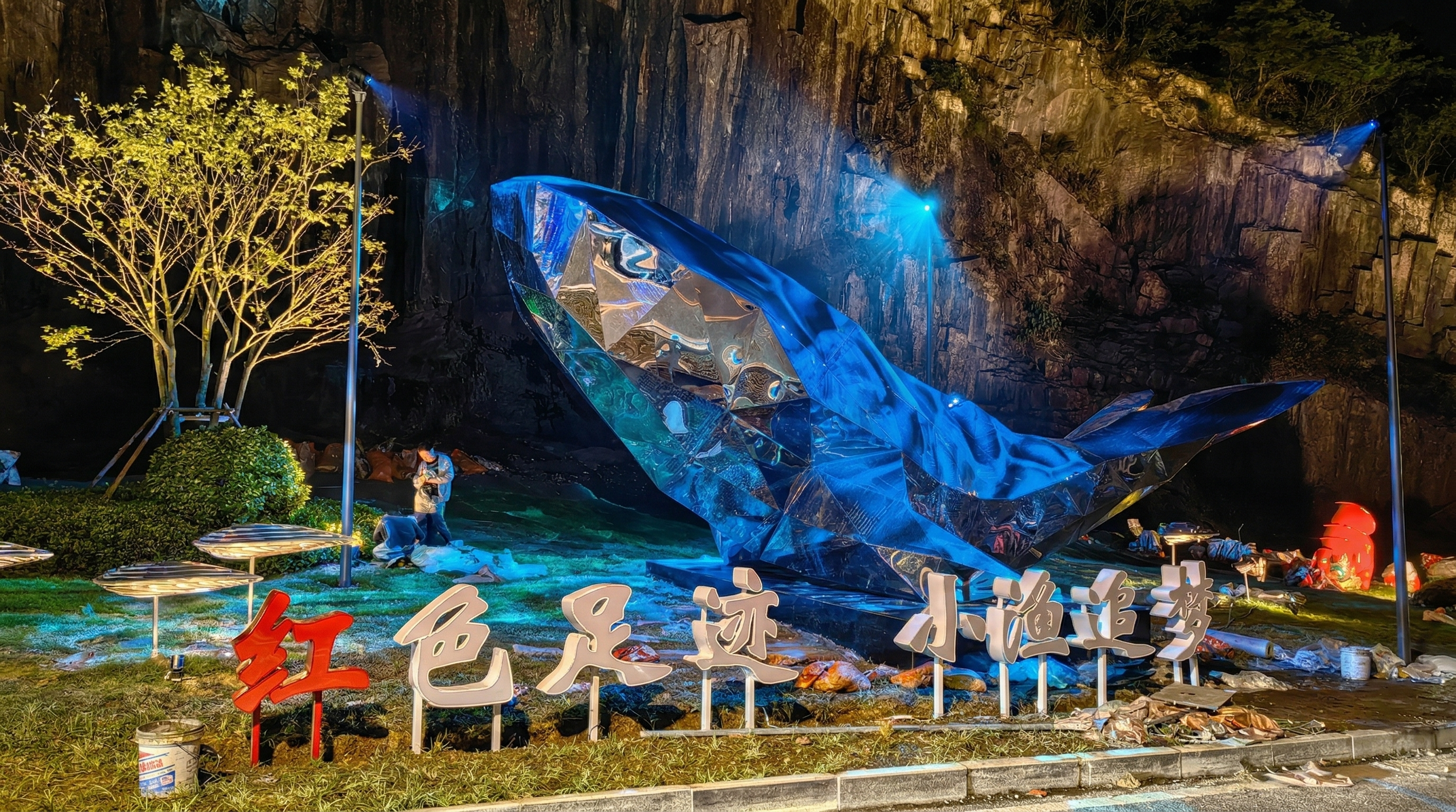 Blue LED linear lights outlining water features and exterior architecture