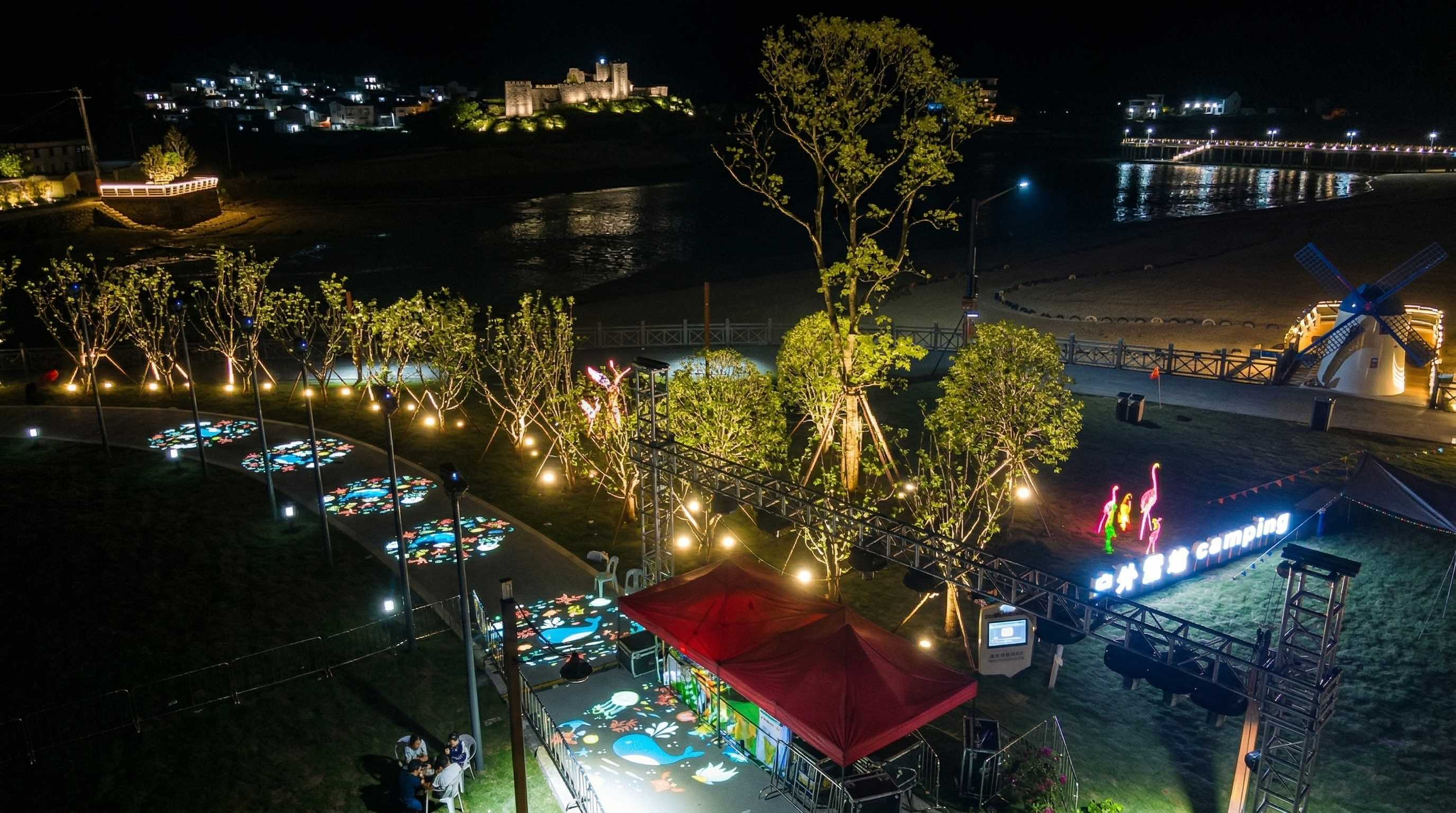 Coastal village night lighting design featuring LED street lamps and floodlights