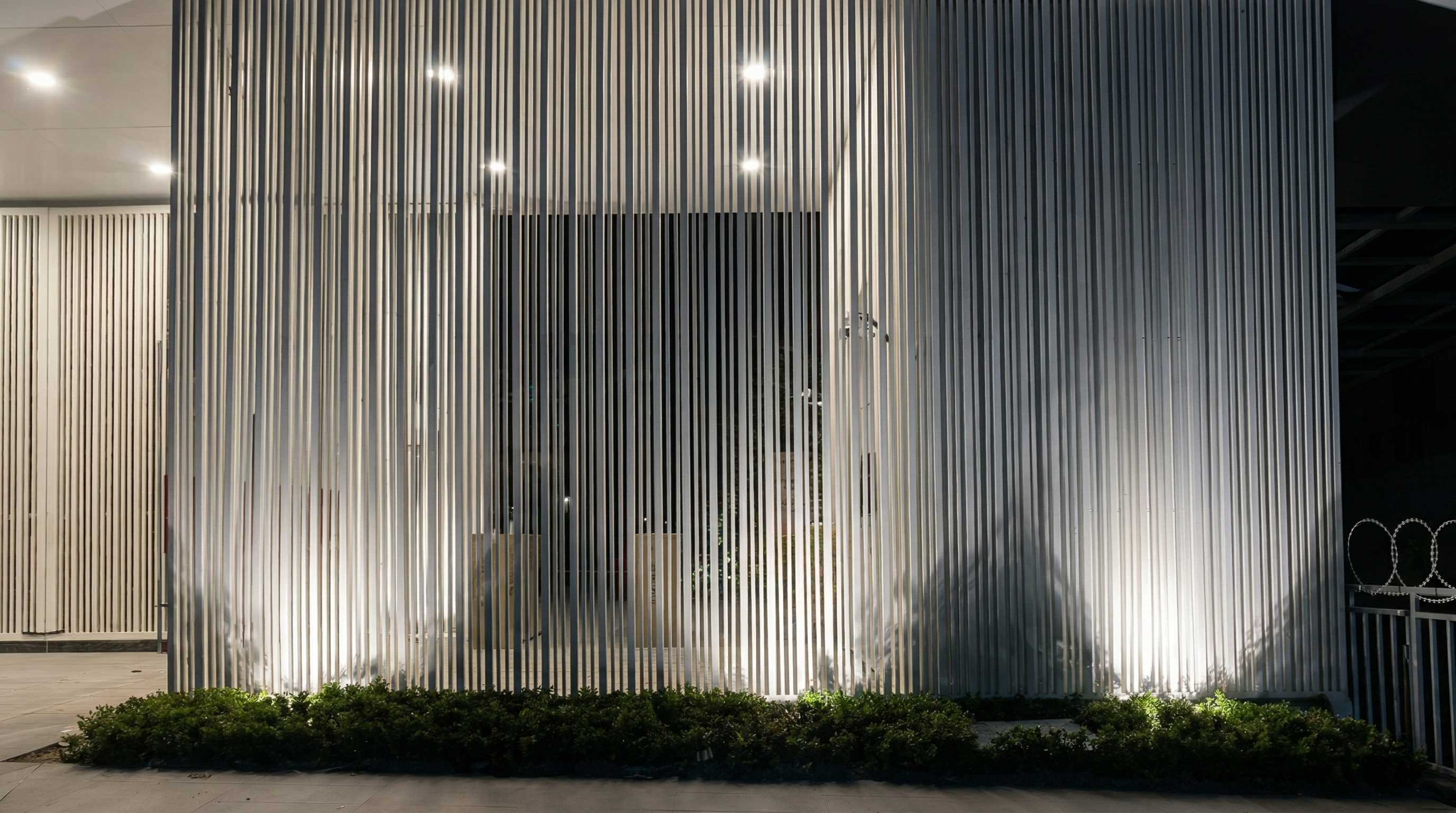 DMX512 controlled exterior facade lighting highlighting vertical building grilles and textures